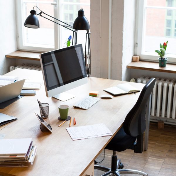 Desk with documents and computer screen
